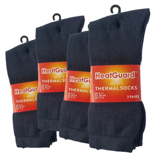 4 Packs of HeatGuard men's thermal socks with labels on a white background