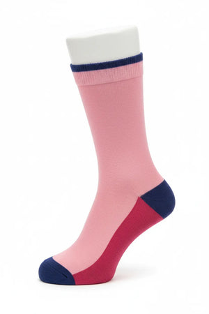 Pink knee-high sock with navy accents on a white background