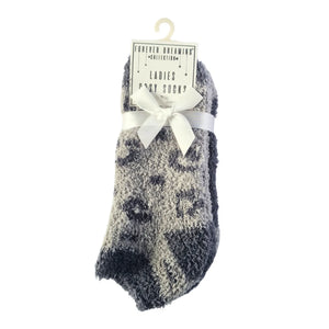 Packaged pair of grey animal print socks with a white bow on a white background
