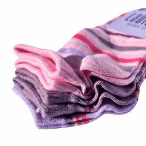 Stack of colourful striped womens trainer socks on a white background