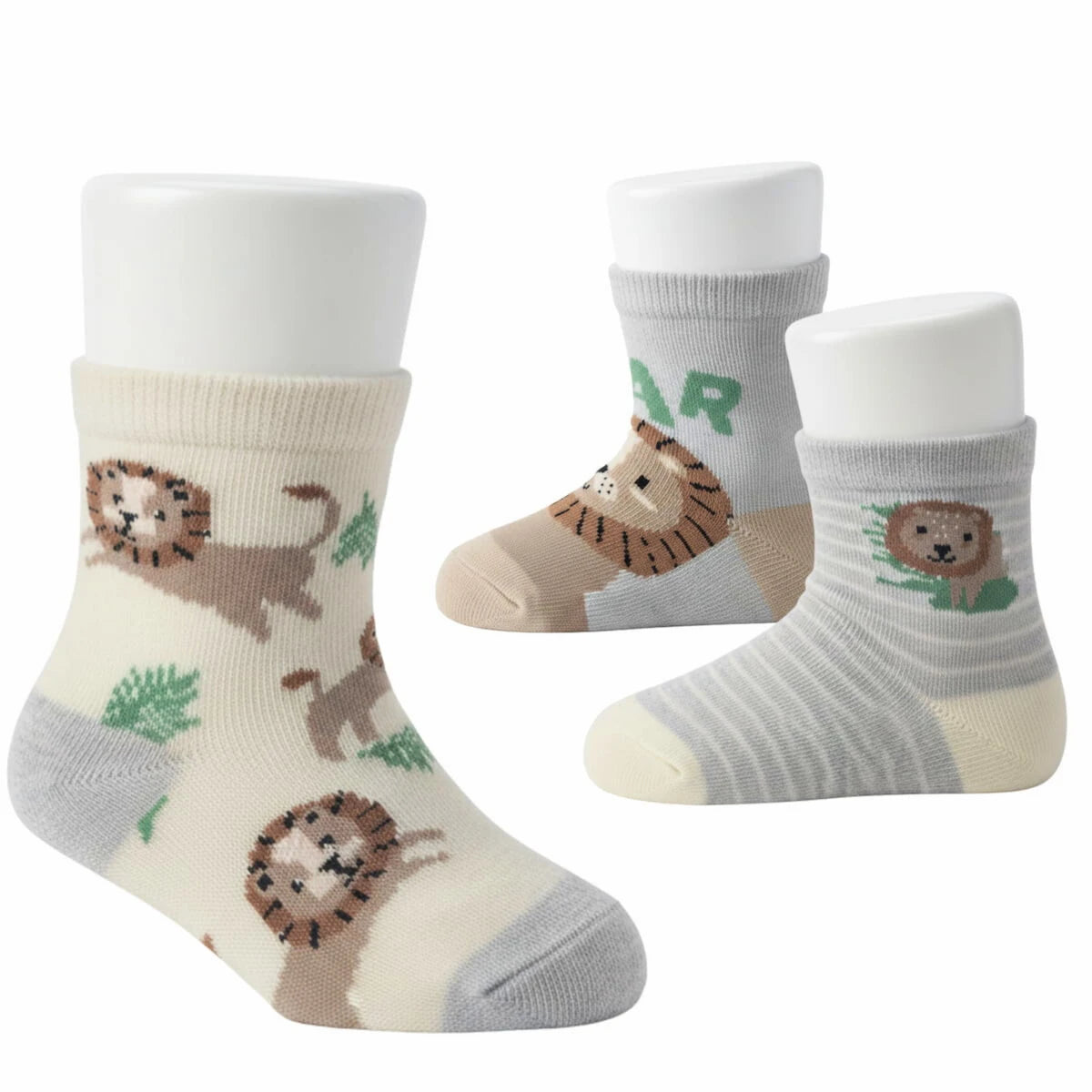 Three pairs of baby socks with lion designs on a white background