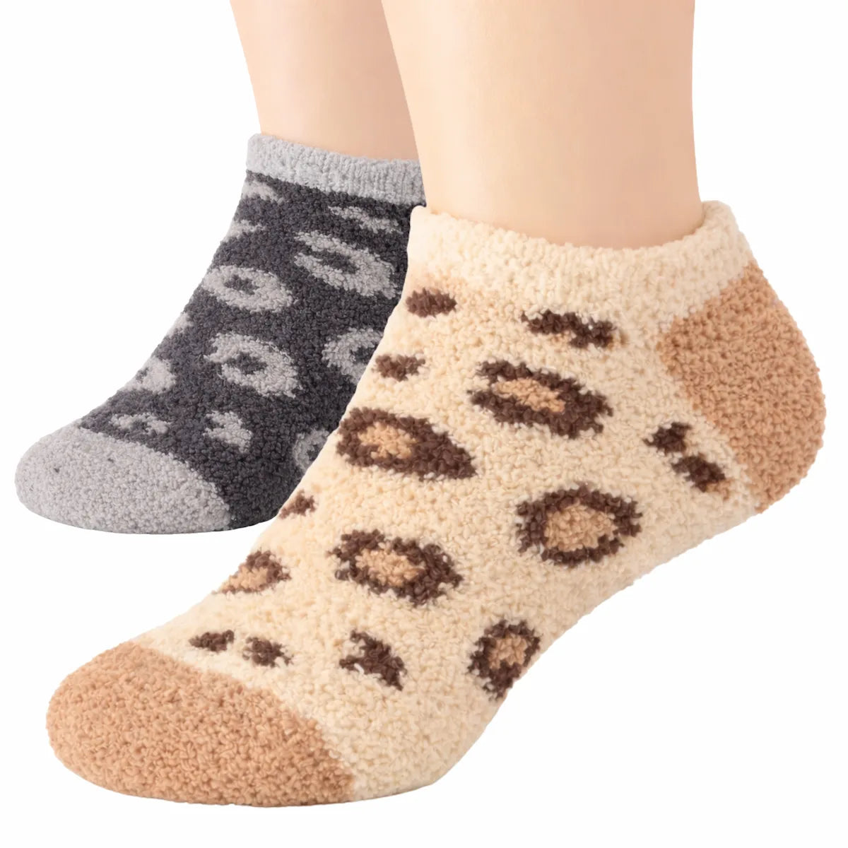 Two pairs of socks, one grey with paw prints and one beige with leopard print, on a white background.