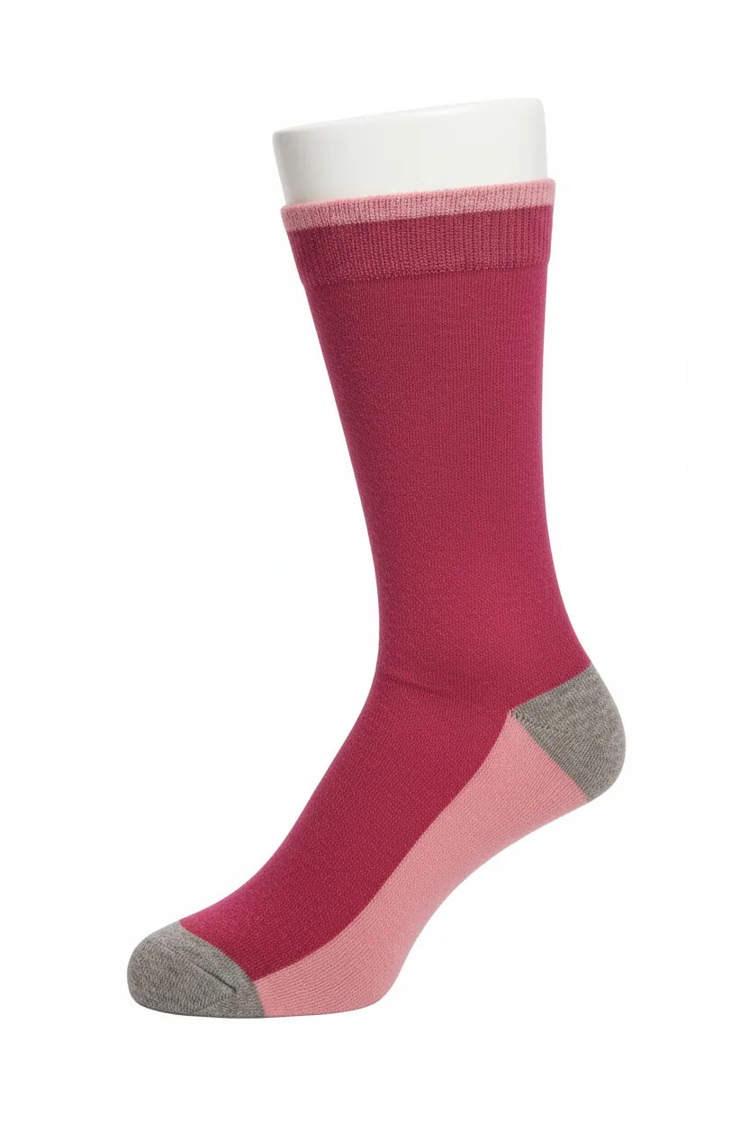 dark pink knee-high sock with gey toe and heel on a white background