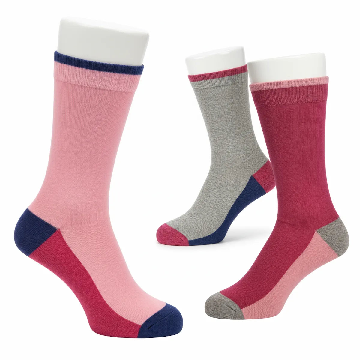 Three pairs of colourful socks on a white background