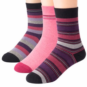 Three pairs of striped socks in pink, purple, and black on a white background
