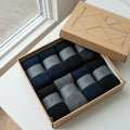 Box of socks with a geometric design on a light surface